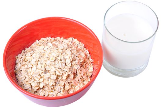 Closeup of a bowl of oatmeal and a glass of milk