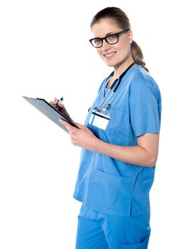 Female doctor holding a clipboard isolated over white