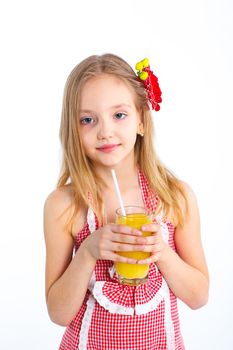 Portrait of happy little girl drinking orange juice. Isolated over white background.