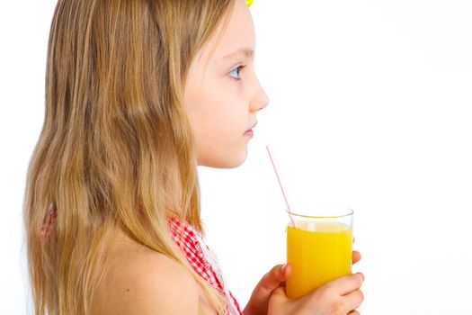 Portrait clouseup of happy little girl drinking orange juice. Isolated over white background.