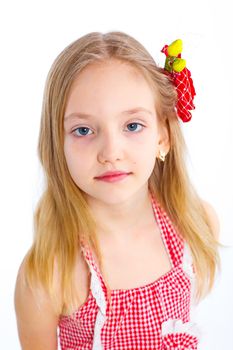 Portrait of cute little girl in red clothes on white background