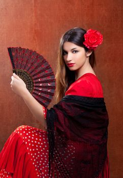 Gipsy flamenco dancer Spain girl with red rose and spanish hand fan