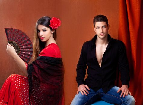 Gipsy flamenco dancer couple from Spain with red rose and spanish hand fan