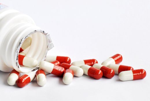 Closeup of red and white medicine capsules