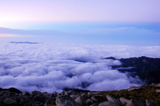 Cloudscape on the top of the mountains at sunrise