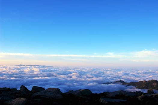 Cloudscape on the top of the mountains at sunrise