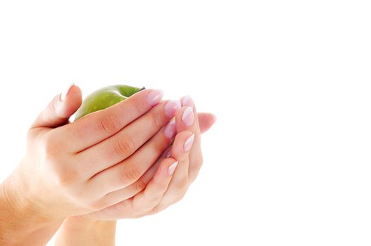 Beautiful female hands with nice french manicure and green apple