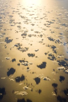 clouds above ocean - view from plane