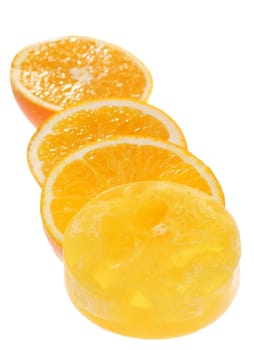 Juicy orange slices with scrubbing soap on white background. Shadow DoF.