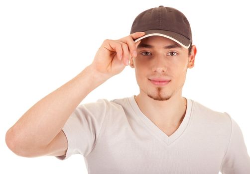 Serious young man in a brown hat is touching the hat peak