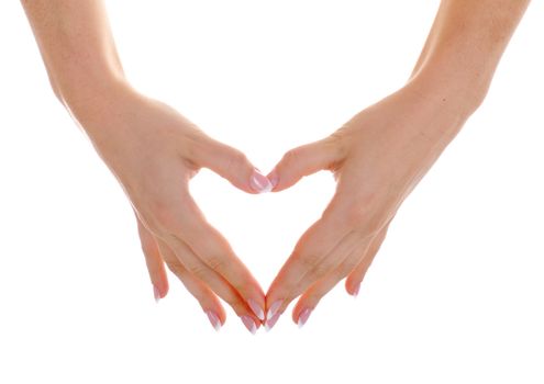 Female hands with nice french manicure show heart