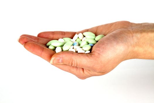 left hand with pills for healthcare