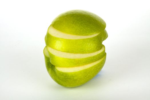 fresh green apple in four slices