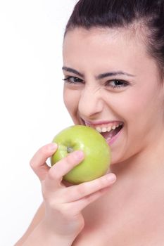 beautiful young brunette girl with a green apple 