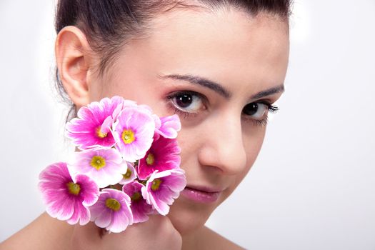 young beautiful brunette woman with flower