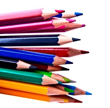 a bunch of colored pencils on a light background