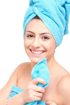 young beautiful woman with a towel doing wellness