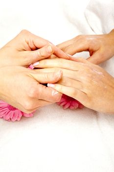feminin hands with a treatment doing a manicure closeup
