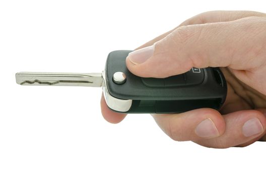 Detail of male hand holding car key. Isolated over white background.