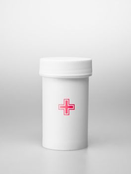 Small white medecine bottle