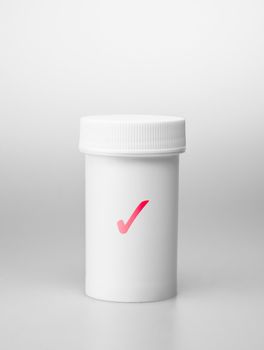 Small white medecine bottle