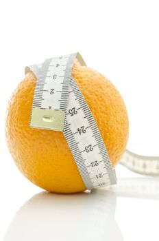 Orange with white measuring tape. Isolated over white background.