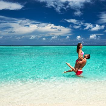 Couple on a tropical beach at Maldives