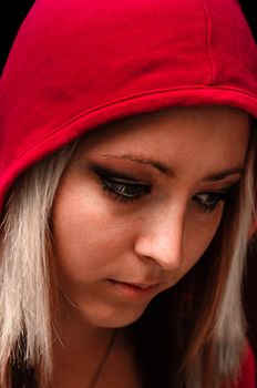 Attractive young woman in red hood
