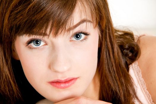 portrait of a beautiful young brunette girl with a bright smile