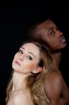 young beautiful caucasian woman with a man with dark skin couple lovers