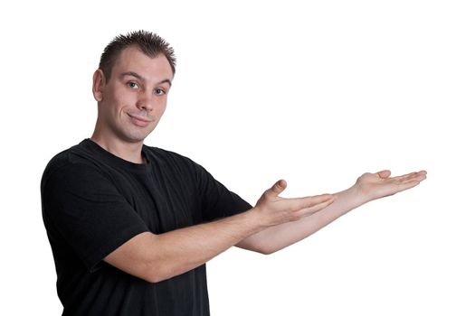 young man holding, showing something in his palm - isolated on white background