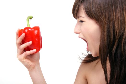 young beautiful girl with a red pepper in her hand