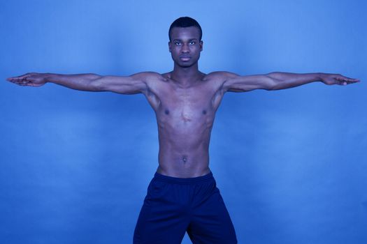 young man with black skin ist doing fittness