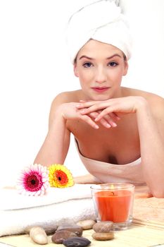 young beautiful woman with a towel doing wellness