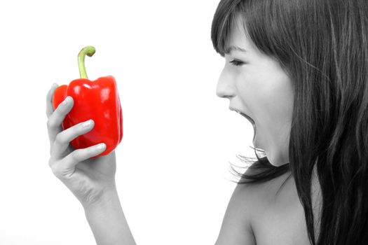 young beautiful girl with a red pepper in her hand