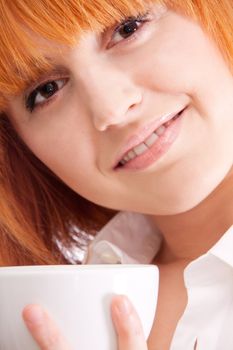 beautiful woman with red hair and a cup of tea