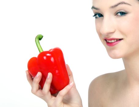 young beautiful girl with a red pepper in her hand