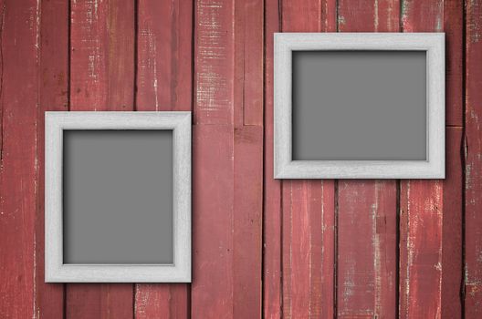 Two white wood picture frame on Red color paint plank wall for background