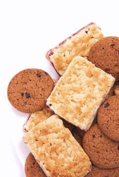 Delicious chocolate chip cookies on white plate 