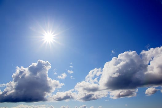 A picture of a bright sun and some heavy skies.