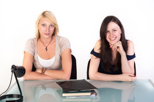 Two beautiful student girls getting ready for school isolated