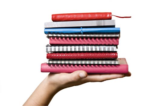 Stack of books in hand on white background