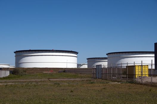 big oil  in harbour with blue sky as background