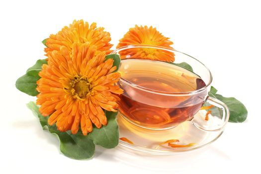 marigold tea with Calendula flowers and leaves on a light background