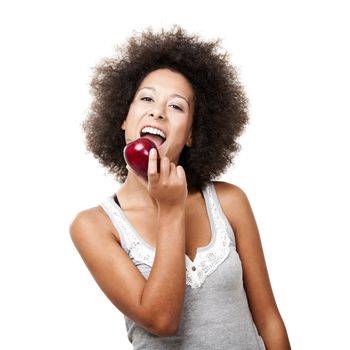 African American  young woman holding and eating an apple