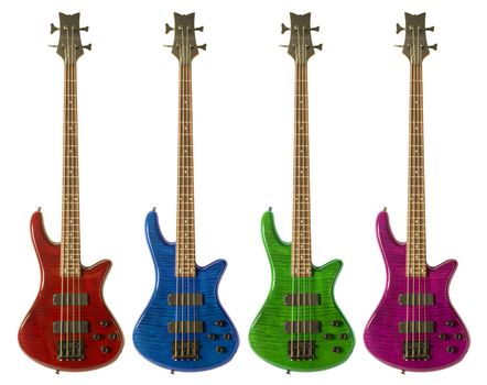 Multi-colored bass guitars against white background
