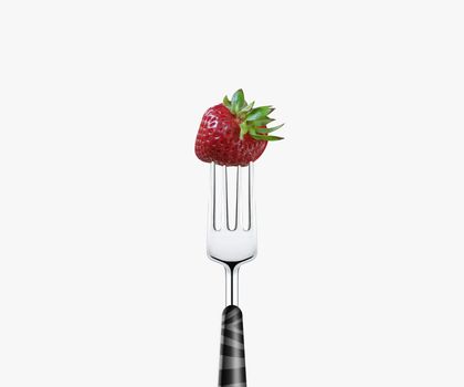 strawberry pierced by fork, isolated on white background