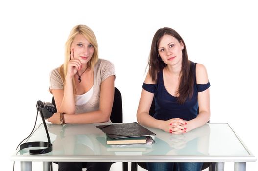 Two beautiful student girls getting ready for school isolated