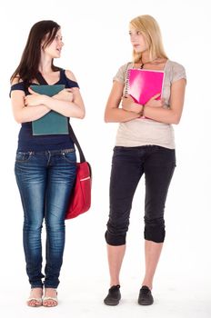 Two beautiful student girls getting ready for school isolated