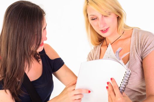 Two beautiful student girls getting ready for school isolated